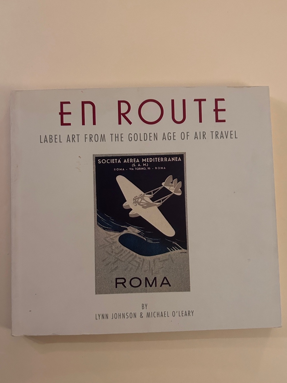 Chronicle Books EN ROUTE Hardcover in White and Maroon